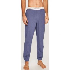 Calvin Klein Underwear - Spodnie piżamowe. Niebieskie piżamy męskie Calvin Klein Underwear, m, bez wzorów, z elastanu, bez rękawów. W wyprzedaży za 159,90 zł.