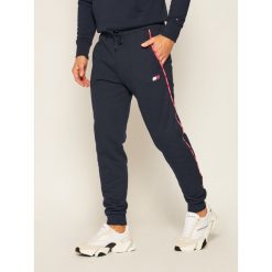 Spodnie dresowe Tommy Sport Piping Fleece Cuffed Pant S20S200462. Niebieskie jeansy męskie Tommy Sport, s, bez wzorów, sportowe. Za 399,00 zł.