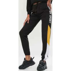 Czarno-Żółte Spodnie Elinnaya. Czarne spodnie damskie Born2be, s, z dresówki. Za 79,99 zł.