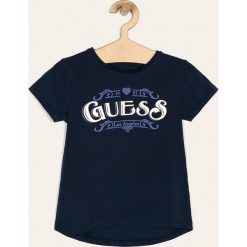 Guess Jeans - T-shirt dziecięcy 118-175 cm. Niebieskie bluzki dziewczęce Guess Jeans, z nadrukiem, z elastanu, z okrągłym kołnierzem, z krótkim rękawem, krótkie, bez kaptura. W wyprzedaży za 79,90 zł.