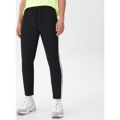 Joggery z lampasami - Czarny. Czarne spodnie męskie House, s, bez wzorów. Za 129,99 zł.