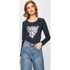 Guess Jeans - Bluzka. Niebieskie bluzki damskie Guess Jeans, s, z nadrukiem, z bawełny, z okrągłym kołnierzem, bez rękawów. Za 189,90 zł.
