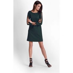 Sukienka z rozciętymi rękawami zielona - 36. Zielone sukienki damskie e-margeritka.pl, na wiosnę, s, bez wzorów, z poliesteru, eleganckie, z długim rękawem, długie, bez kaptura. Za 149,99 zł.