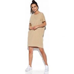 Bawełniana sukienka tuba o luźnym kroju beżowy. Brązowe sukienki damskie producent niezdefiniowany, na co dzień, s, bez wzorów, z bawełny, eleganckie, bez kołnierzyka, bez rękawów, proste. Za 159,90 zł.