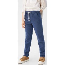 Mango Kids - Spodnie dziecięce Nico6 110-164 cm. Niebieskie spodnie chłopięce Mango Kids, bez wzorów, z bawełny. W wyprzedaży za 49,90 zł.