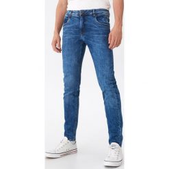 Jeansy slim fit z bawełny organicznej - Niebieski. Niebieskie jeansy męskie House, m, bez wzorów. Za 139,99 zł.