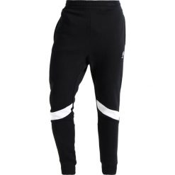 Spodnie dresowe męskie: Reebok Classic Spodnie treningowe black