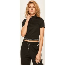 Calvin Klein Jeans - T-shirt. Czarne bluzki damskie Calvin Klein Jeans, s, z aplikacjami, z elastanu, bez kołnierzyka, z krótkim rękawem. W wyprzedaży za 219,90 zł.