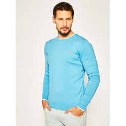 Sweter Guess Brandon M0GR28 Z2NO0. Niebieskie swetry męskie Guess, m, z aplikacjami, z bawełny, klasyczne, z klasycznym kołnierzykiem, bez kaptura. W wyprzedaży za 259,00 zł.