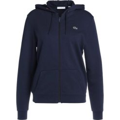 Lacoste Sport WOMEN TENNIS Bluza rozpinana navy blue/apricot. Niebieskie bluzy damskie Lacoste Sport, z bawełny. Za 409,00 zł.
