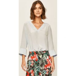 Tommy Hilfiger - Bluzka. Niebieskie bluzki damskie TOMMY HILFIGER, na co dzień, bez wzorów, z wiskozy, eleganckie, bez kołnierzyka, bez rękawów. Za 359,90 zł.