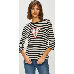 Guess Jeans - Bluzka. Białe bluzki damskie Guess Jeans, s, z aplikacjami, z elastanu, casualowe, z okrągłym kołnierzem, bez rękawów. W wyprzedaży za 179,90 zł.
