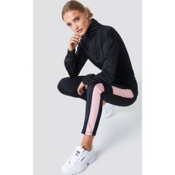 Bryczesy damskie: NA-KD Urban Spodnie sportowe - Black