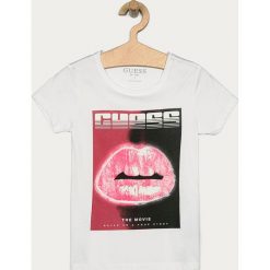 Guess Jeans - T-shirt dziecięcy 116-175 cm. Białe bluzki dziewczęce Guess Jeans, z nadrukiem, z bawełny, z okrągłym kołnierzem, z krótkim rękawem, krótkie, bez kaptura. Za 159,90 zł.