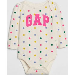 Body w kolorze kremowym ze wzorem. Białe body niemowlęce Gap Kids, z nadrukiem, z bawełny, bez rękawów. W wyprzedaży za 22,95 zł.