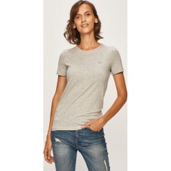 Lacoste - T-shirt. Białe bluzki damskie Lacoste, bez wzorów, z elastanu, z okrągłym kołnierzem. W wyprzedaży za 129,90 zł.
