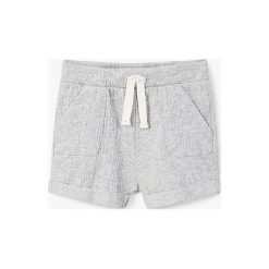Mango Kids - Szorty dziecięce Masnou 62-80 cm. Szare spodenki dziewczęce marki Mango Kids, z bawełny, casualowe. W wyprzedaży za 29,90 zł.