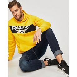 Reebok Classic - Bluza. Żółte bluzy męskie m, z nadrukiem, z elastanu, z kapturem. W wyprzedaży za 179,90 zł.