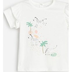Bawełniany t-shirt z aplikacją -. T-shirty damskie Reserved, z aplikacjami, z bawełny, bez kołnierzyka. Za 35,99 zł.