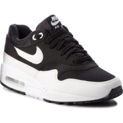 Buty NIKE - Air Max 1 319986 034 Black/White. Czarne buty sportowe damskie Nike, na co dzień, bez wzorów, z tworzywa sztucznego, bez obcasa, na płaskiej podeszwie, bez zapięcia. W wyprzedaży za 479,00 zł.