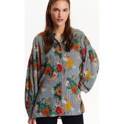 Koszula damska oversize w kratę z nadrukiem kwiatowym, z bufiastymi rękawami. Czarne koszule damskie Top Secret, na co dzień, na zimę, z nadrukiem, eleganckie, bez kołnierzyka, z długim rękawem. Za 89,99 zł.