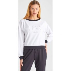 BLUZA liu jo sport. Bluzy sportowe damskie Liu Jo Sport, l, bez wzorów, bez rękawów, bez kaptura. W wyprzedaży za 559,20 zł.