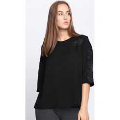 Czarna Bluzka Crazy For You. Czarne bluzki damskie Born2be, na imprezę, xl, bez wzorów, z koronki, z okrągłym kołnierzem, bez rękawów. Za 29,99 zł.