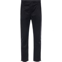 Joggery Champion Reverse Weave Jacquard Logo 212968. Czarne jeansy męskie Champion, s, bez wzorów, z bawełny. W wyprzedaży za 169,00 zł.