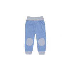 Spodnie niemowlęce chłopięce sportowe. Niebieskie spodnie niemowlęce marki TXM. Za 15,99 zł.