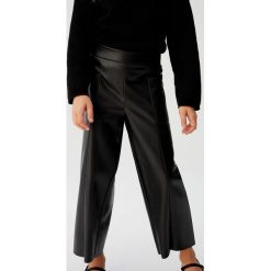 Mango Kids - Spodnie dziecięce Rocio 110-164 cm. Czarne spodnie dziewczęce Mango Kids, bez wzorów, z poliesteru. Za 119,90 zł.