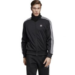 Bluza adidas Firebird (DV1530). Czarne bluzy męskie Adidas, m, bez wzorów, z poliesteru, bez kołnierzyka, bez rękawów, bez kaptura. Za 209,99 zł.