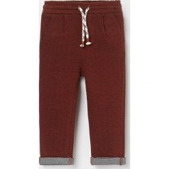Spodnie w jodełkę - Brązowy. Pomarańczowe spodnie męskie Reserved, m, bez wzorów. Za 49,99 zł.