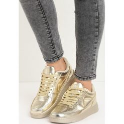 Złote Buty Sportowe Trini. Żółte buty sportowe damskie marki NEWFEEL, z gumy. Za 49,99 zł.