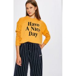 Tommy Jeans - Bluza. Pomarańczowe bluzy damskie Tommy Jeans, s, z nadrukiem, z elastanu, bez rękawów, bez kaptura. W wyprzedaży za 219,90 zł.