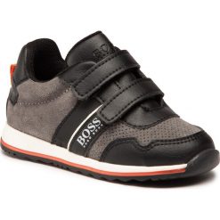 Sneakersy BOSS - J09139 Grey 054. Szare trampki chłopięce Boss, bez wzorów, ze skóry, na rzepy. Za 429,00 zł.