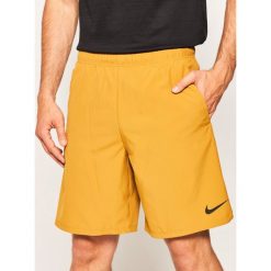 Szorty sportowe NIKE Flex 927526. Żółte spodnie męskie Nike, s, bez wzorów, z poliesteru, sportowe. W wyprzedaży za 109,00 zł.