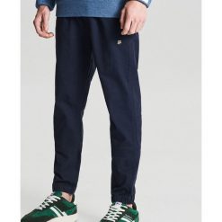 Spodnie slim jogger - Granatowy. Niebieskie spodnie męskie Cropp, m, bez wzorów. Za 119,99 zł.