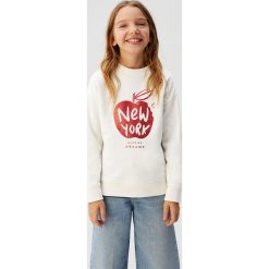 Mango Kids - Bluza dziecięca Dubliny 110-164 cm. Białe bluzy dziewczęce Mango Kids, z aplikacjami, z bawełny, bez rękawów, bez kaptura. Za 59,90 zł.