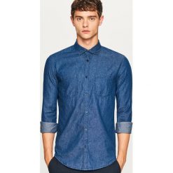 Jeansowa koszula slim fit - Granatowy. Niebieskie koszule męskie jeansowe marki Reserved, m. Za 119,99 zł.