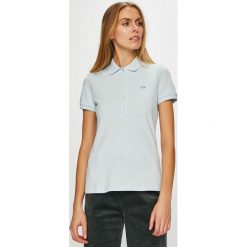 Lacoste - Top. Niebieskie topy damskie marki Lacoste, z elastanu. W wyprzedaży za 249,90 zł.