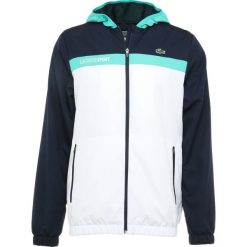 Lacoste Sport TENNIS JACKET Kurtka sportowa navy blue/white/papeete. Niebieskie kurtki sportowe męskie Lacoste Sport, m, z materiału. Za 629,00 zł.