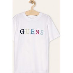 Guess Jeans - T-shirt dziecięcy 118-175 cm. Białe t-shirty chłopięce Guess Jeans, z aplikacjami, z bawełny, bez rękawów. W wyprzedaży za 89,90 zł.