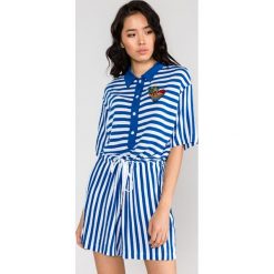 Love Moschino Kombinezon Niebieski Biały. Niebieskie spodnie damskie Love Moschino, m, z elastanu. Za 1558,95 zł.