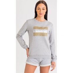 BLUZA trussardi jeans. Bluzy damskie Trussardi Jeans, m, bez wzorów, z jeansu, bez rękawów, bez kaptura. W wyprzedaży za 300,30 zł.