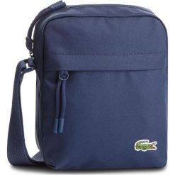 Saszetka LACOSTE - NH2102NE Peacoat 992. Niebieskie torby męskie skórzane marki Lacoste, bez wzorów, z materiału, młodzieżowe. Za 299,00 zł.