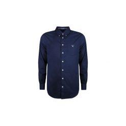 Koszule z długim rękawem Gant 304000 / The plain broadcloth. Niebieskie koszule męskie GANT, xl, bez wzorów, bez kołnierzyka, z długim rękawem. Za 279,00 zł.