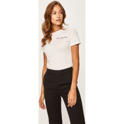 Calvin Klein Jeans - T-shirt. Czarne bluzki damskie Calvin Klein Jeans, s, z aplikacjami, z bawełny, casualowe, z okrągłym kołnierzem. Za 229,90 zł.