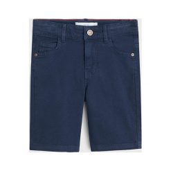 Mango Kids - Szorty dziecięce Peru 110-164 cm. Niebieskie spodenki chłopięce Mango Kids, bez wzorów, z elastanu, casualowe. W wyprzedaży za 49,90 zł.