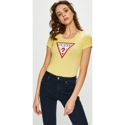 Guess Jeans - Top. Żółte bluzki damskie Guess Jeans, s, z nadrukiem, z elastanu, casualowe, z okrągłym kołnierzem, z krótkim rękawem. Za 139,90 zł.