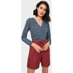 Elegancka bluzka. Bluzki damskie Greenpoint, bez wzorów, z poliesteru, eleganckie, bez kołnierzyka, bez rękawów. Za 59,99 zł.